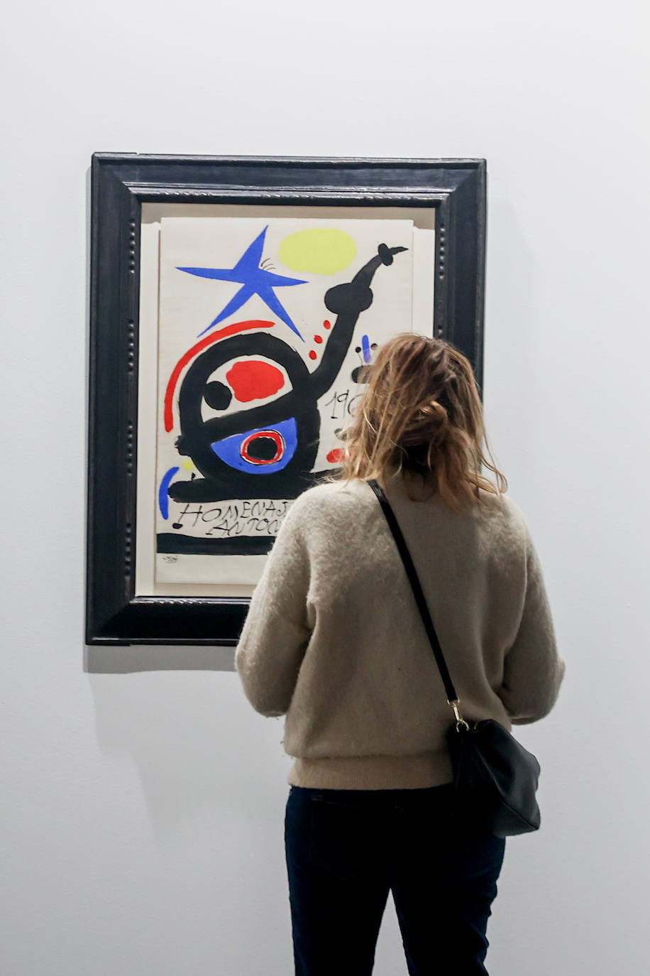 Una mujer observa un cuadro en ARCO 2023, en Feria de Madrid IFEMA de Madrid,