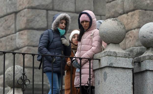 Los abrigos y gorros han llegado para quedarse.