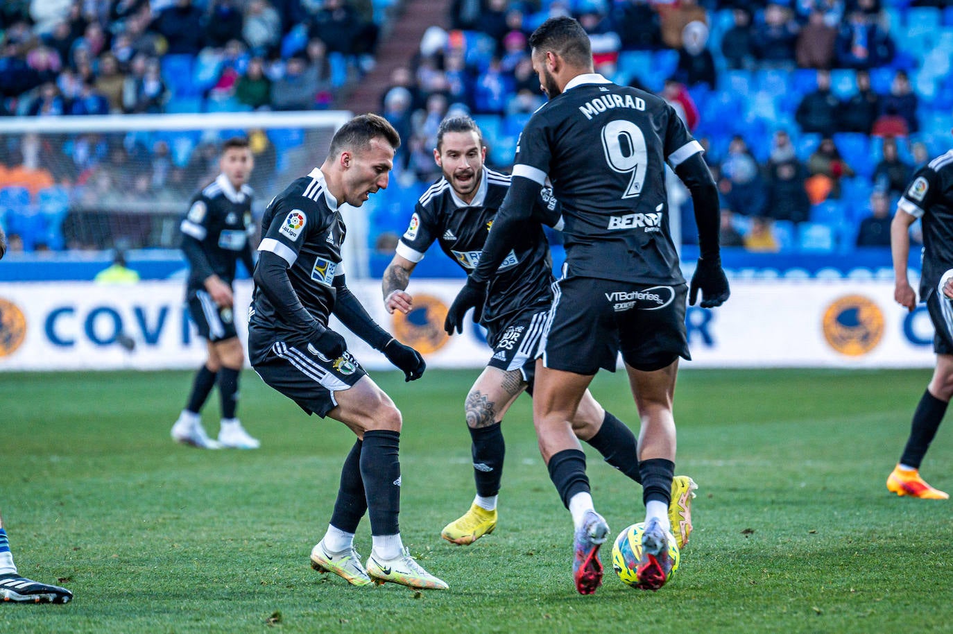 Fotos: El Burgos CF araña un punto en La Romareda