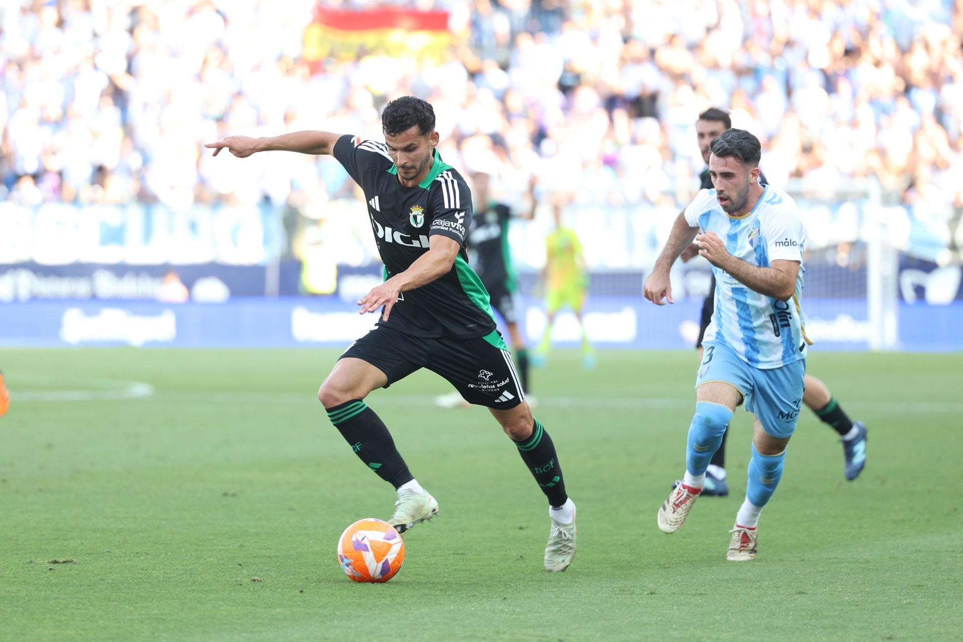 El encuentro del Málaga y del Burgos CF en La Rosaleda, en imágenes