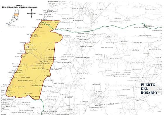 En amarillo, el mancomún del municipio de Puerto del Rosario; en verde, las lindes entre municipios; y las cuatro cuadrículas (en lila) del permiso de exploración de tierras raras, cerca del puertito de Los Molinos.