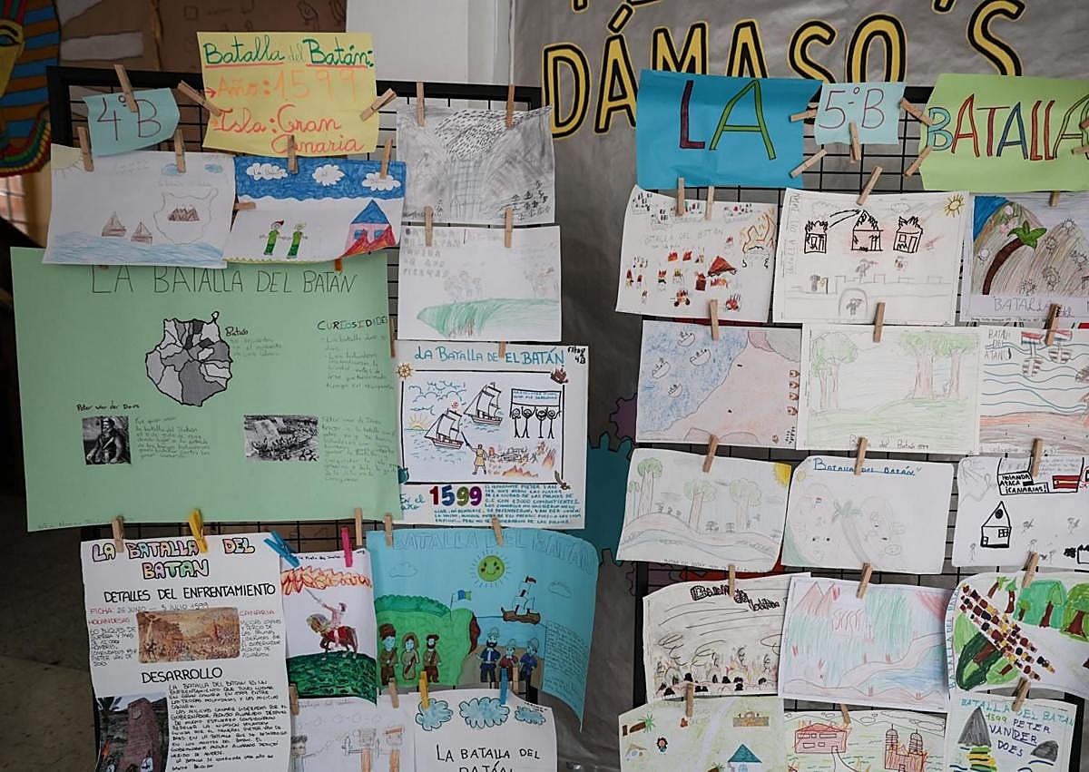 Imagen secundaria 1 - Integrantes de la asociación y trabajos del alumnado.