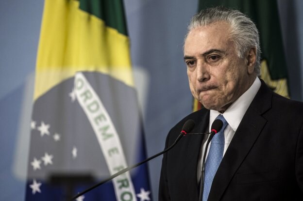 Temer se libra del juicio penal y salva el mandato con su base parlamentaria. :: Joédson Alves / efe