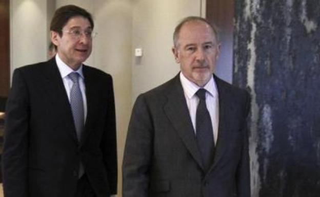 José Ignacio Goirigolzarri (izquierda) y Rodrigo Rato, en la sucesión presidencial de Bankia. 