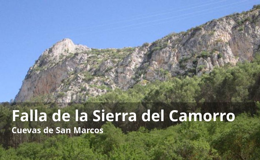 Entre el pantano de Iznájar y el pueblo de Cuevas de San Marcos, se encuentra la Falla de la Sierra del Camorro, una formación caliza declarada como monumento natural de Andalucía por su valor geológico. Entre un mar de olivos emerge este macizo kárstico que supera los 900 metros de altitud sobre el nivel del mar. Sus espectaculares cortantes verticales tienen su origen en el Jurásico. En este enclave, se encuentra precisamente la cueva de Belda, una de las grutas más interesantes del país, que actualmente no está abierta al público debido a la presencia de una amplia colonia protegida de murciélagos. En la zona alta de la falla se encuentran los restos de lo que fue la ciudad medieval de Belda.