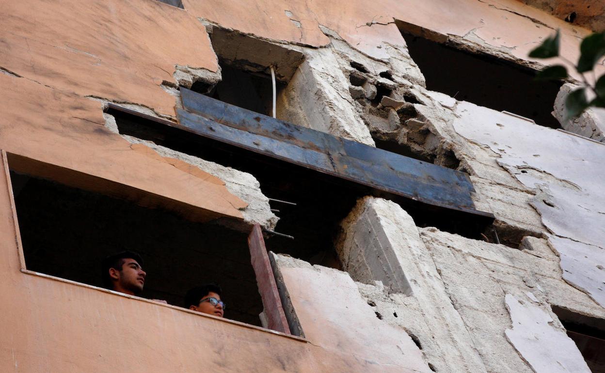 Estado en el que quedó uno de los edificios dañados por el bombardeo en Damasco.