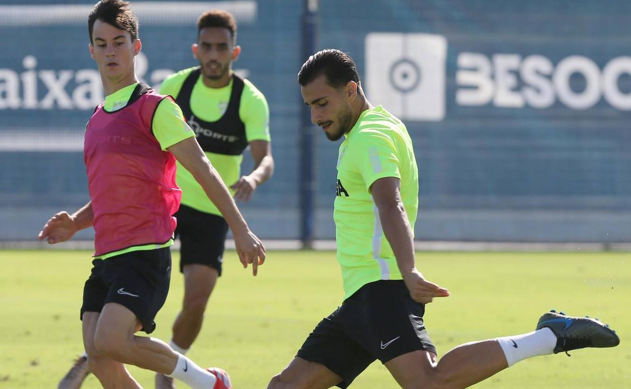 Juanpi, junto a Luis Muñoz, en un entrenamiento reciente. 