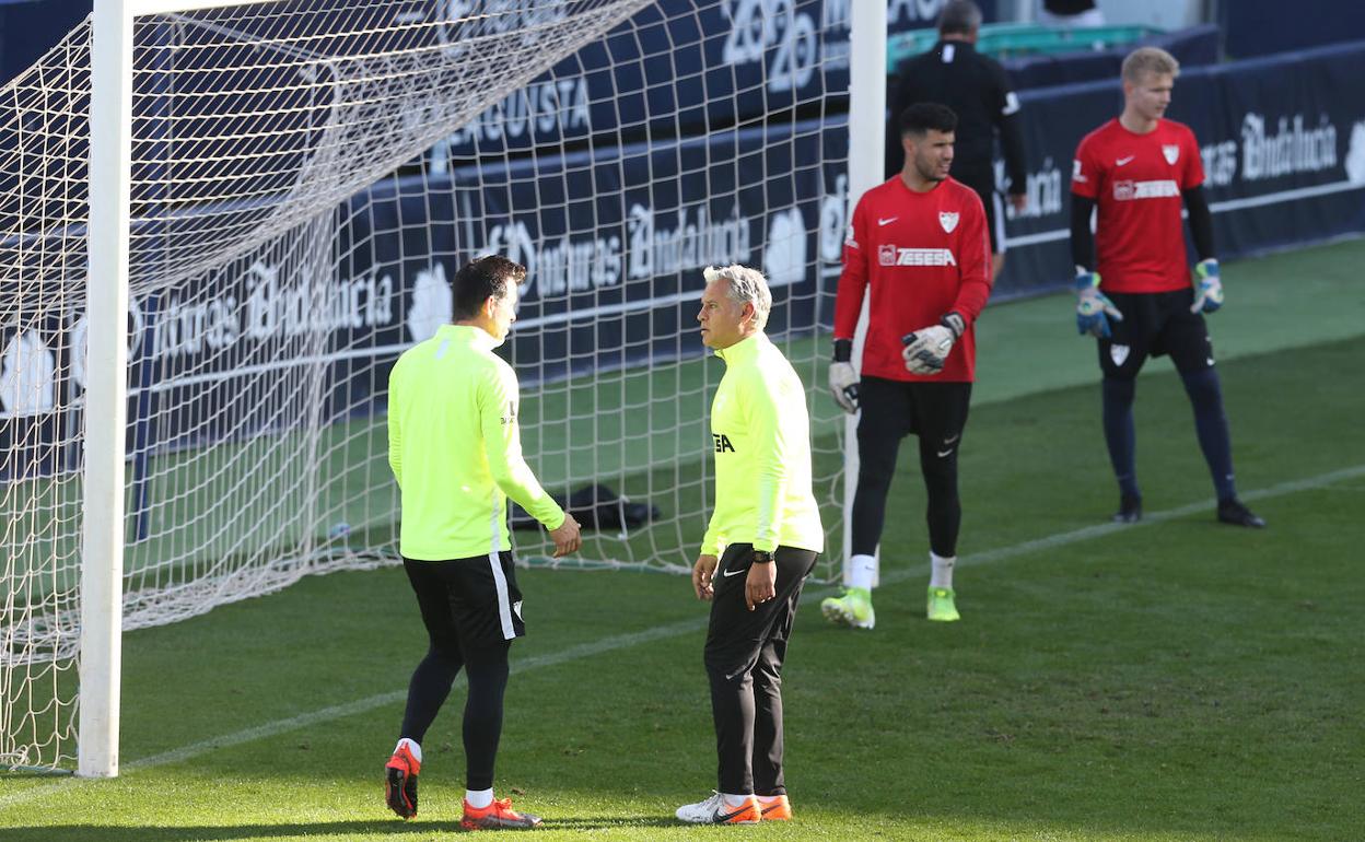 Pellicer dialoga con Contreras, en el entrenamiento de este lunes. 