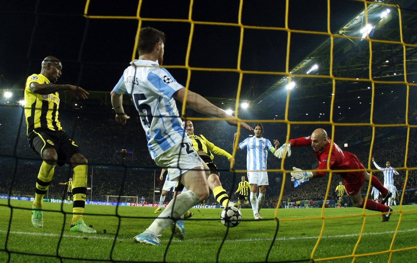 La injusta eliminación del Málaga en la Champions en el campo del Dortmund cumple hoy siete años con las mismas dudas que el primer día. Revive aquel momento foto a foto.