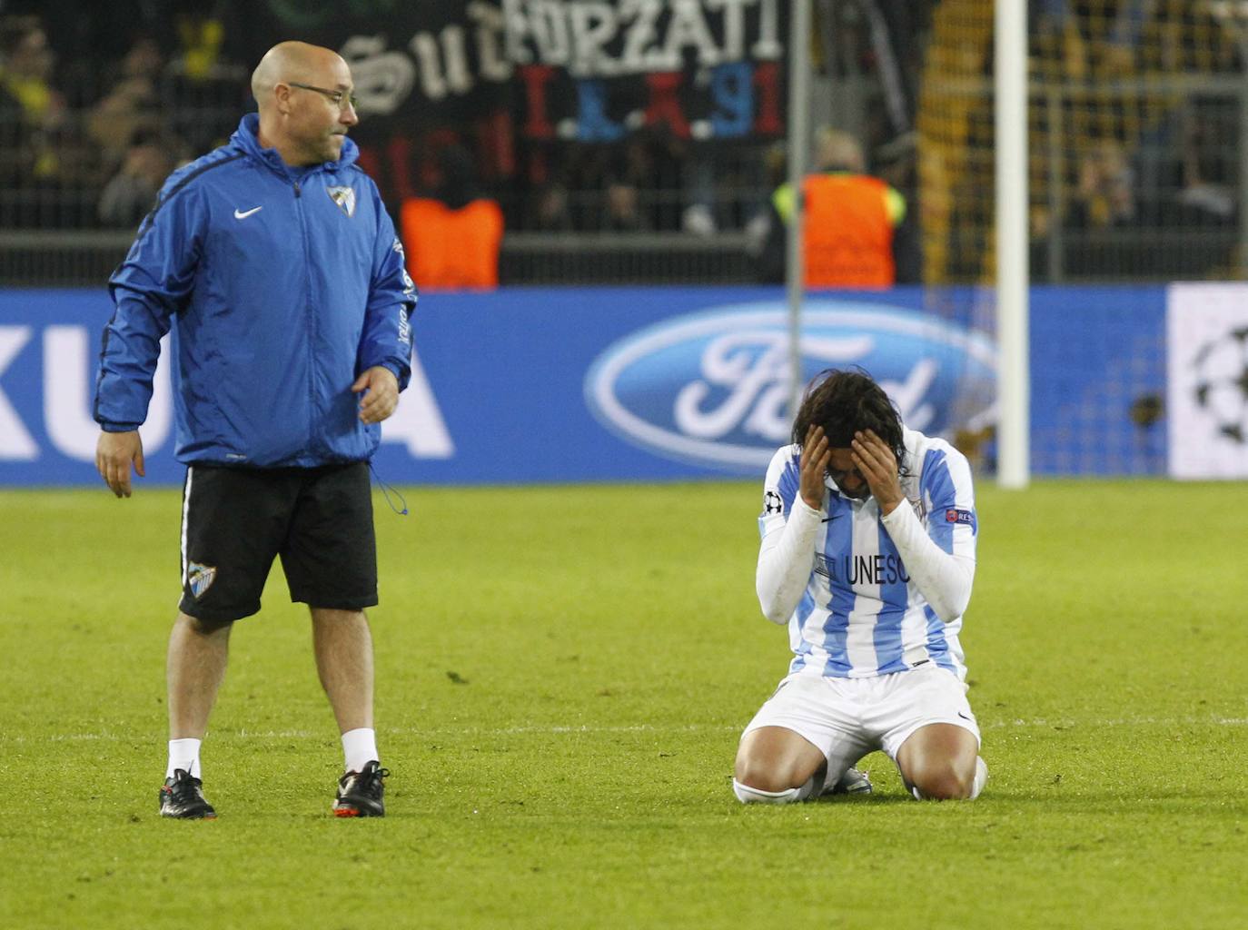 La injusta eliminación del Málaga en la Champions en el campo del Dortmund cumple hoy siete años con las mismas dudas que el primer día. Revive aquel momento foto a foto.