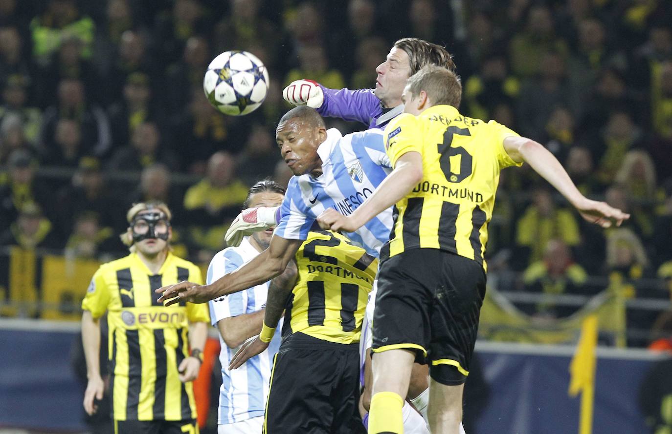 La injusta eliminación del Málaga en la Champions en el campo del Dortmund cumple hoy siete años con las mismas dudas que el primer día. Revive aquel momento foto a foto.