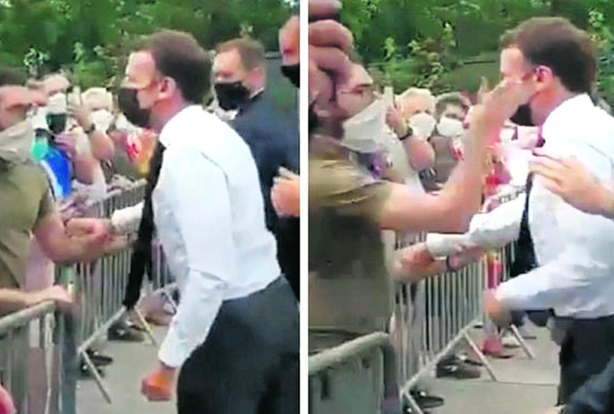 Un hombre agarra a Macron por el brazo y le golpea el rostro, según el vídeo difundido en las redes sociales. 