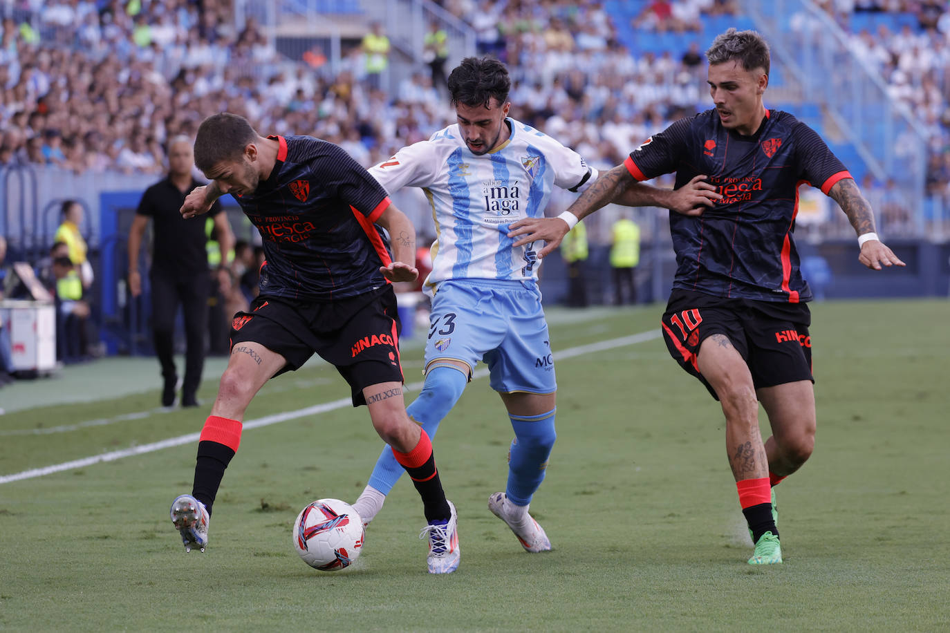 El Málaga-Huesca, en imágenes