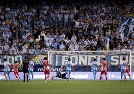 Imagen de la espectacular parada de Alfonso Herrero durante el partido contra el Sporting.