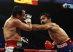 Triunfo polémico de Pacquiao sobre Márquez