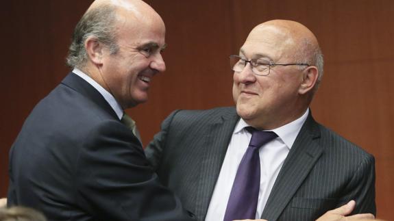 Luis de Guindos con Michel Sapin.