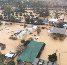 Vista aérea tomada por un helicóptero de la zona inundada por el desbordamiento del río Guadalhorce en la zona de la Estación de Cártama.