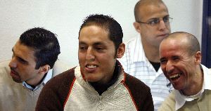 ACUSADOS. De izquierda a derecha, Jamal Zougam, Rachid Aglif, Rafa Zouhier y Abdelilah El Fadoual escuchan con despreocupación la sentencia. / PACO CAMPOS. AFP