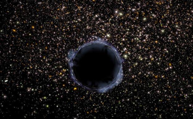 Recreacion artistica de un agujero negro de tamaño mediano rodeado de uucleo de brillantes estrellas.