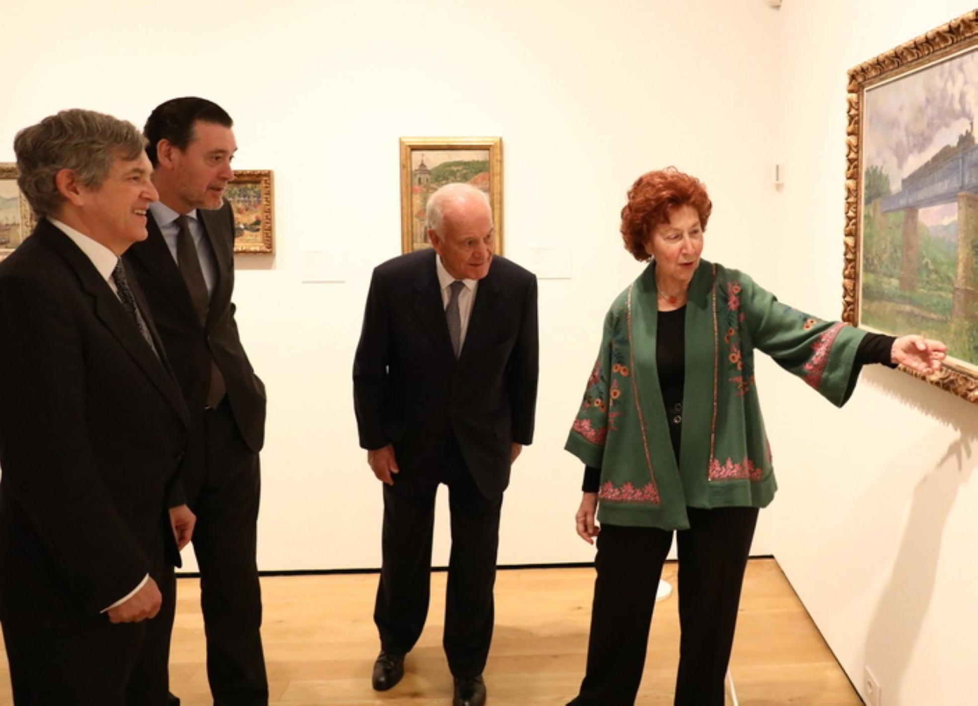  Coleccionistas y obrasMaría Corral, Juan Entrecanales, Miguel Zugaza y Javier Barón. Arriba, 'La ría de Bilbao', de Regoyos. A la derecha, 'Paisaje de Bretaña', de Beruete.