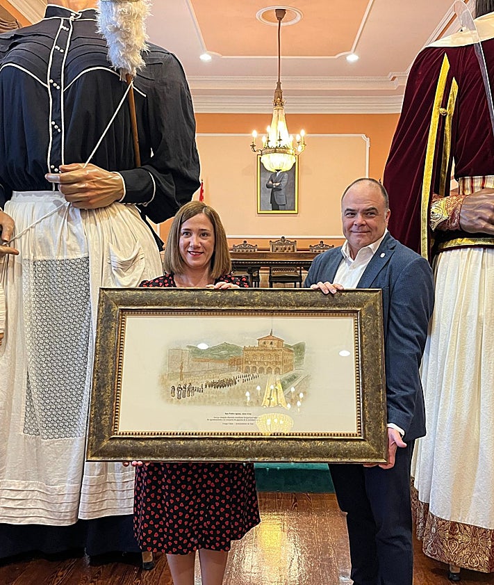 Imagen secundaria 2 - El Ayuntamiento entrego a Irungo Atsegiña una ilustración del Día de San Pedro. durante un acto en el que comparseros y gigantes llenaron la sala capitular