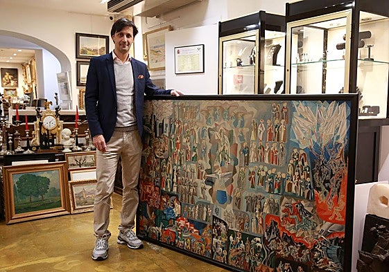 Helder Lobelos, junto al cuadro de José Sarriegui que realizó para el ábside del santuario pero que no presentó al concurso.