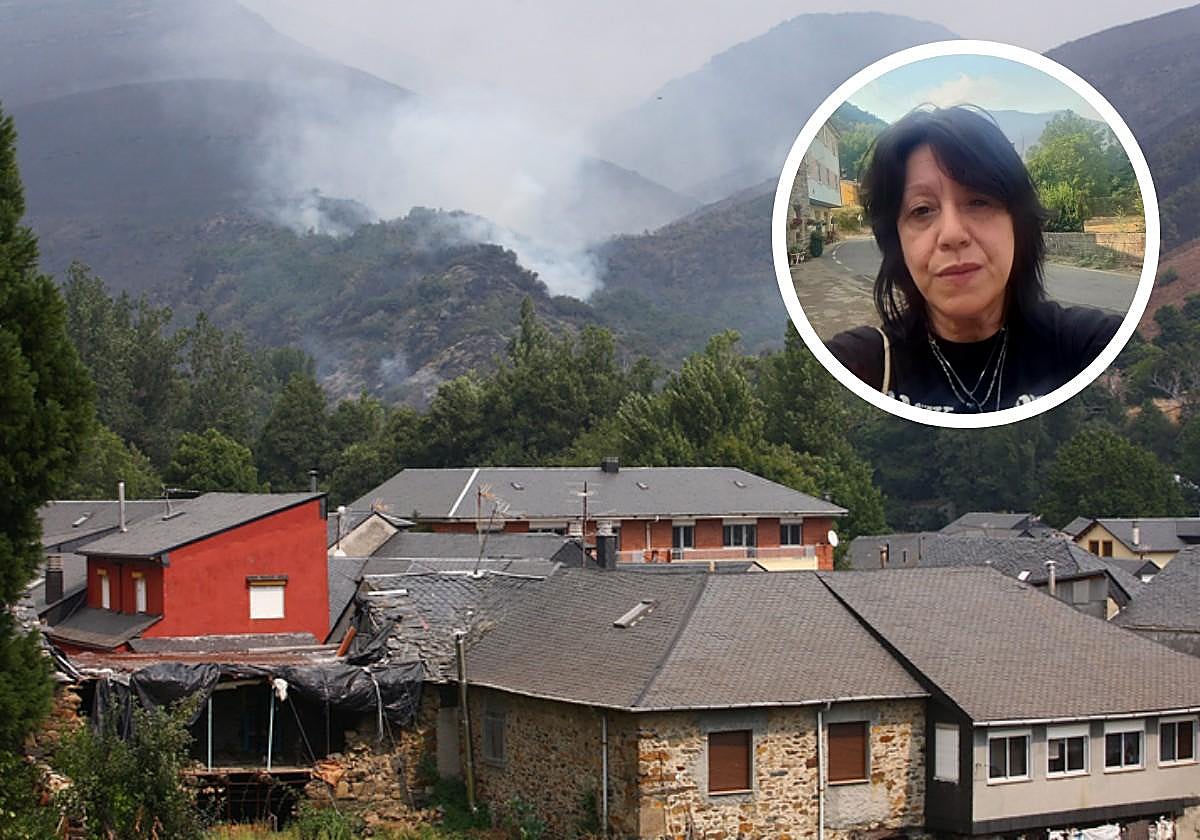 La vecina de Igüeña, Marisol Blanco (D), junto a una imagen del incendio que mantiene en jaque a la localidad.