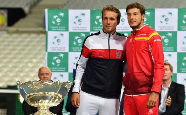 El tenista francés Lucas Pouille y Pablo Carreño.