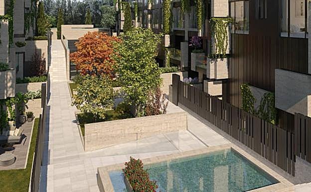 Interior de la urbanización de lujo, donde se pueden ver los detalles de la fachada ajardinada.