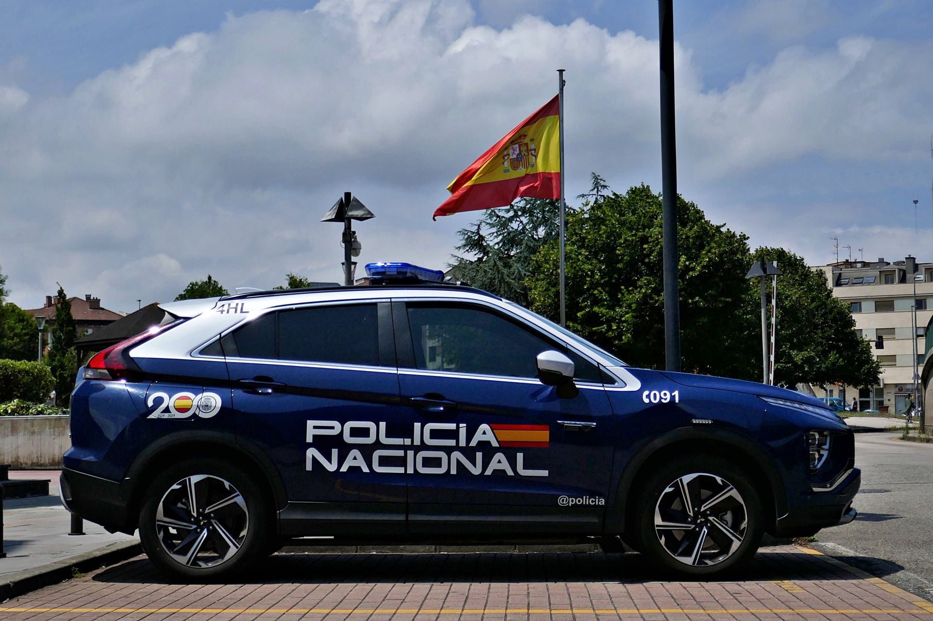 Un coche de la Policía Nacional en Gijón.