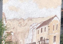 María Jesús Real pintando el gran mural con 'La Campurra' a la entrada de Rioseco