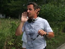 Sarkozy con la camiseta sudada / AFP PHOTO/Nicholas KAMM