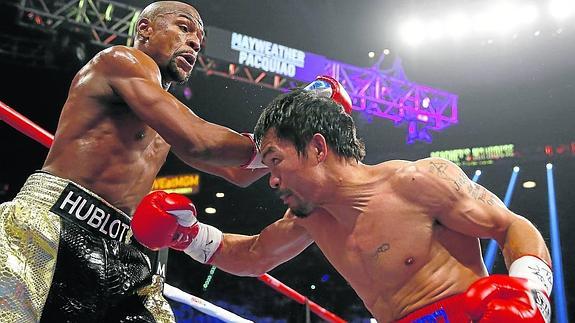 Mayweather gana con polémica