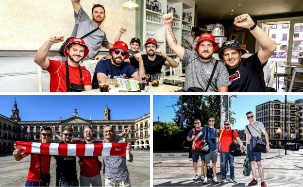 Seguidores del Liverpool en un establecimiento hostelero de Vitoria, blandiendo blanden su bandera en la plaza de España y en el entorno de Lovaina.