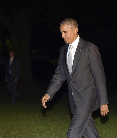 Obama junto a la Casa Blanca