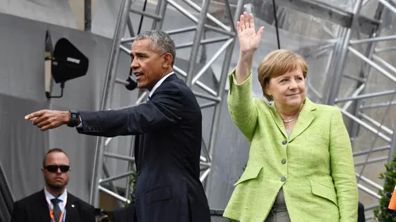 Obama y Merkel en el acto del Congreso de la Iglesia Evangélica en la berlinesa Puerta de Brandeburgo. 