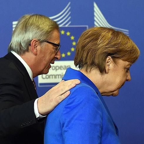 Jean-Claude Juncker con la canciller alemana, Angela Merkel.