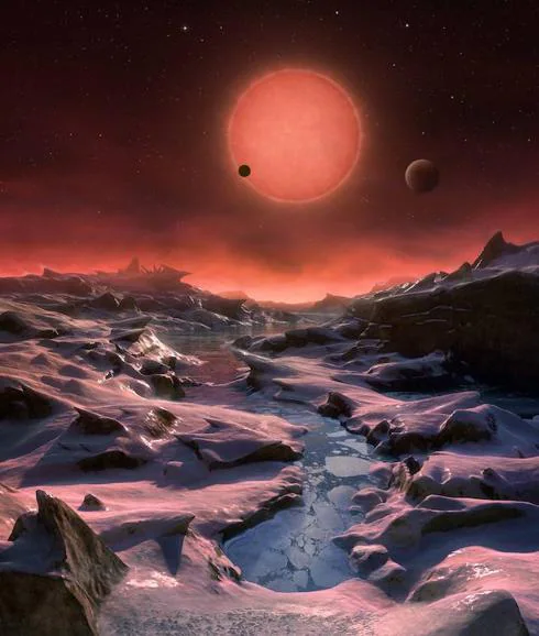 Ilustración de la superficie terrestre de unos de los siete planetas que orbitan TRAPPIST-1.