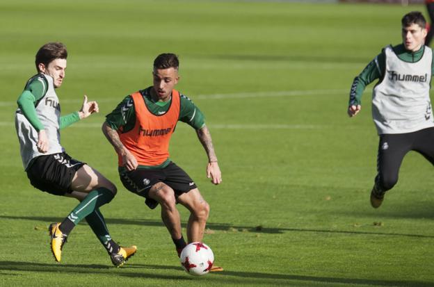 Quique Rivero, junto a Franco Acosta.