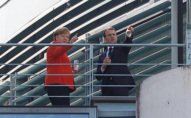 Merkel y Macron.