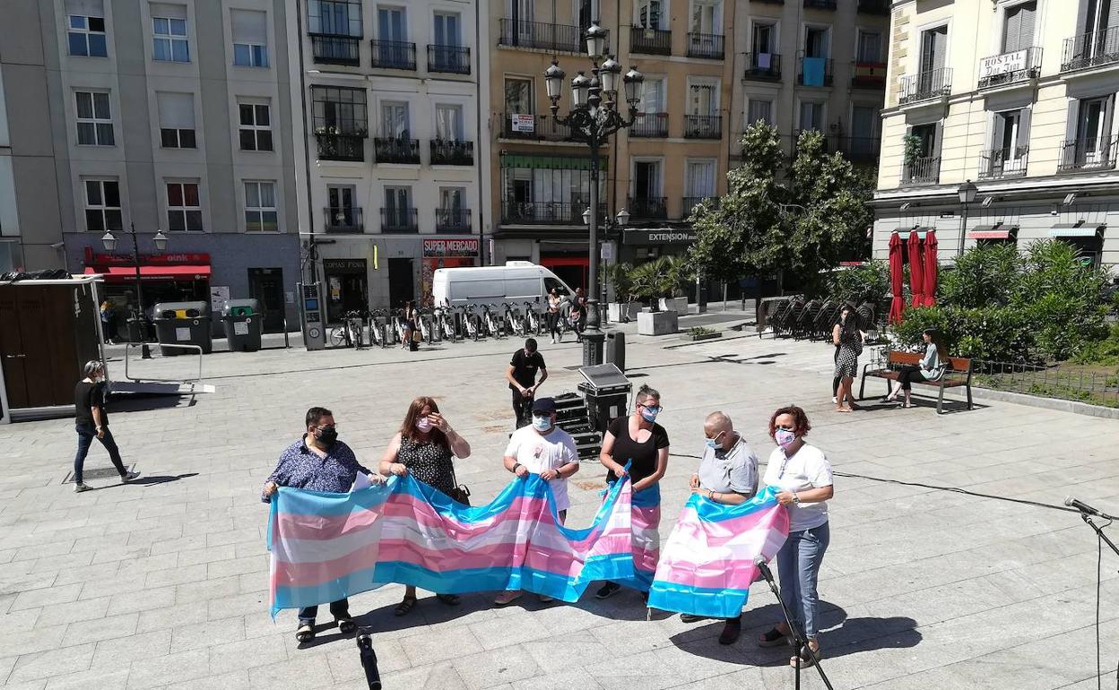 Representantes de los colectivos trans en la plaza Pedro Zerolo, en Madrid, tras la reunión con el Gobierno.