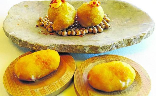 Imagen. Imprescindibles. Buñuelos de compango del cocido y las famosas croquetas de jamón ibérico, 'campeonas del mundo en Madrid Fusión 2017' . 