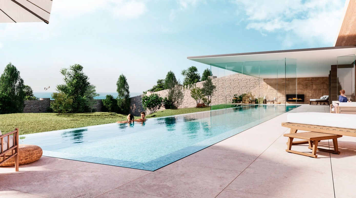 Vista de la piscina y el jardín intramuros. Bajo las ruinas se ubicará la zona de gimnasios, excavando el terreno y aprovechando la orografía existente y abiertas por su fachada este. Todos los espacios en los que se encuentran las piscinas dan al valle y se conforma la unión exterior/interior mediante grandes ventanales.