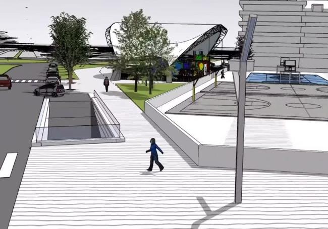 Salida del parking junto a la nueva plaza pública con un parque.