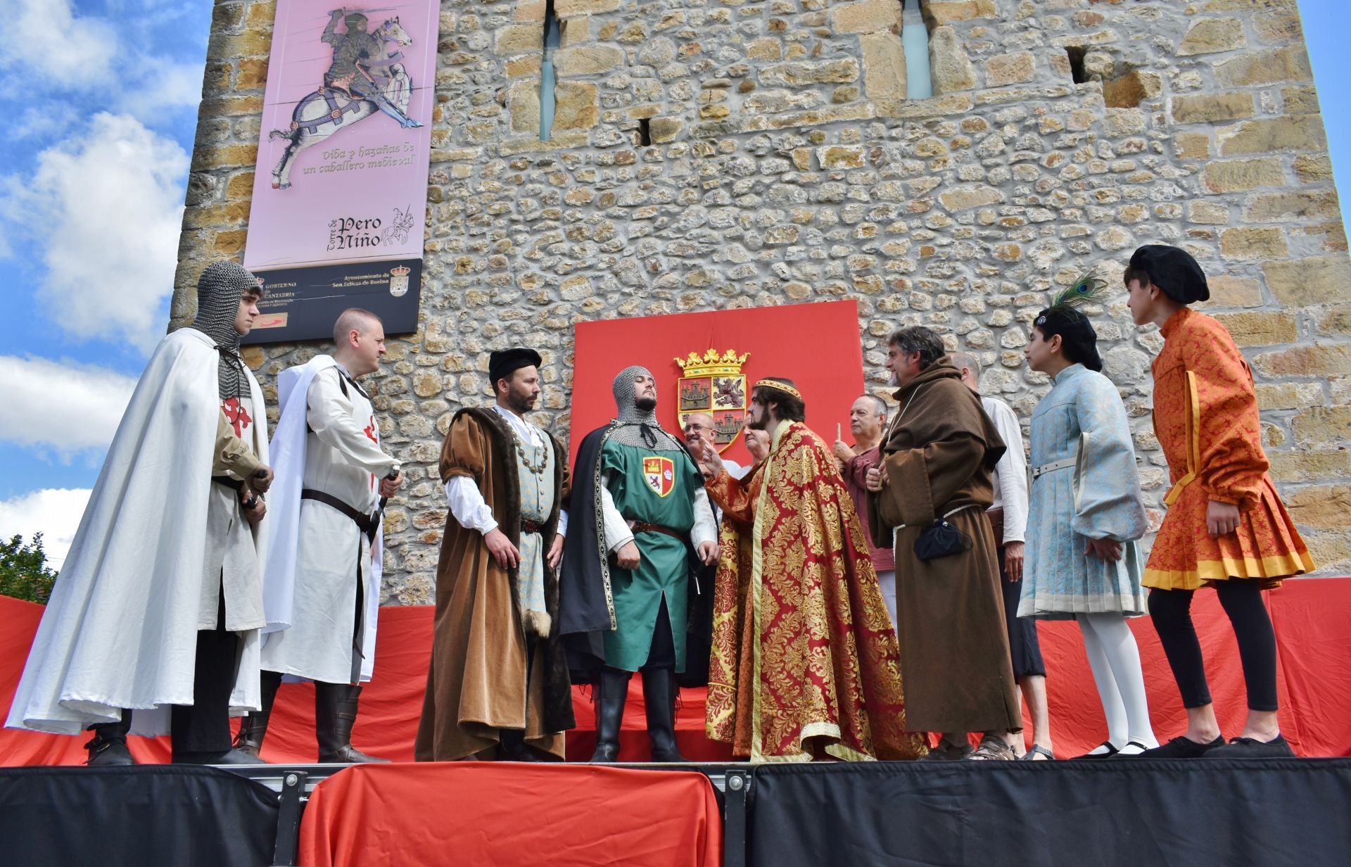 Los hombres se reúnen en torno al Rey y Pero Niño para dirimir sus diferencias.