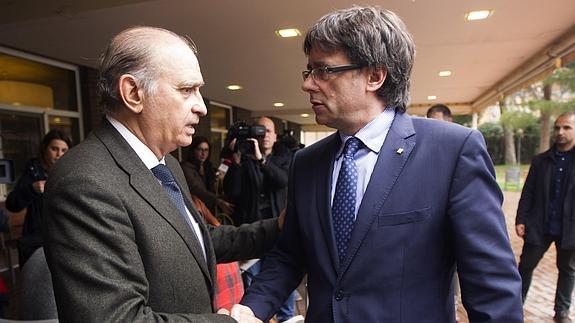 El ministro del Interior en funciones, Jorge Fernández Díaz, y el presidente de la Generalitat. 