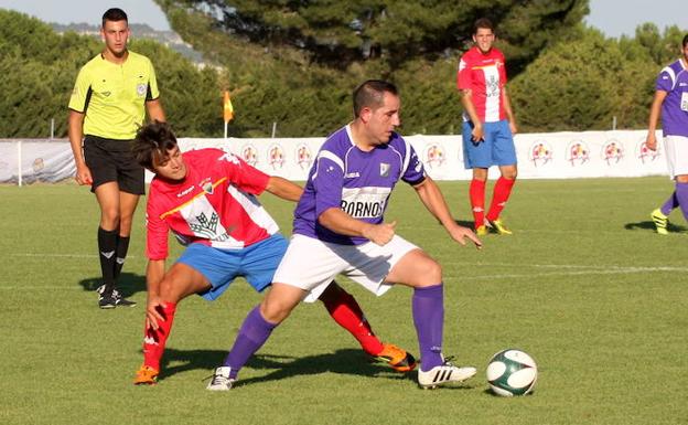 Dos jugdores durante una acción del partido. 