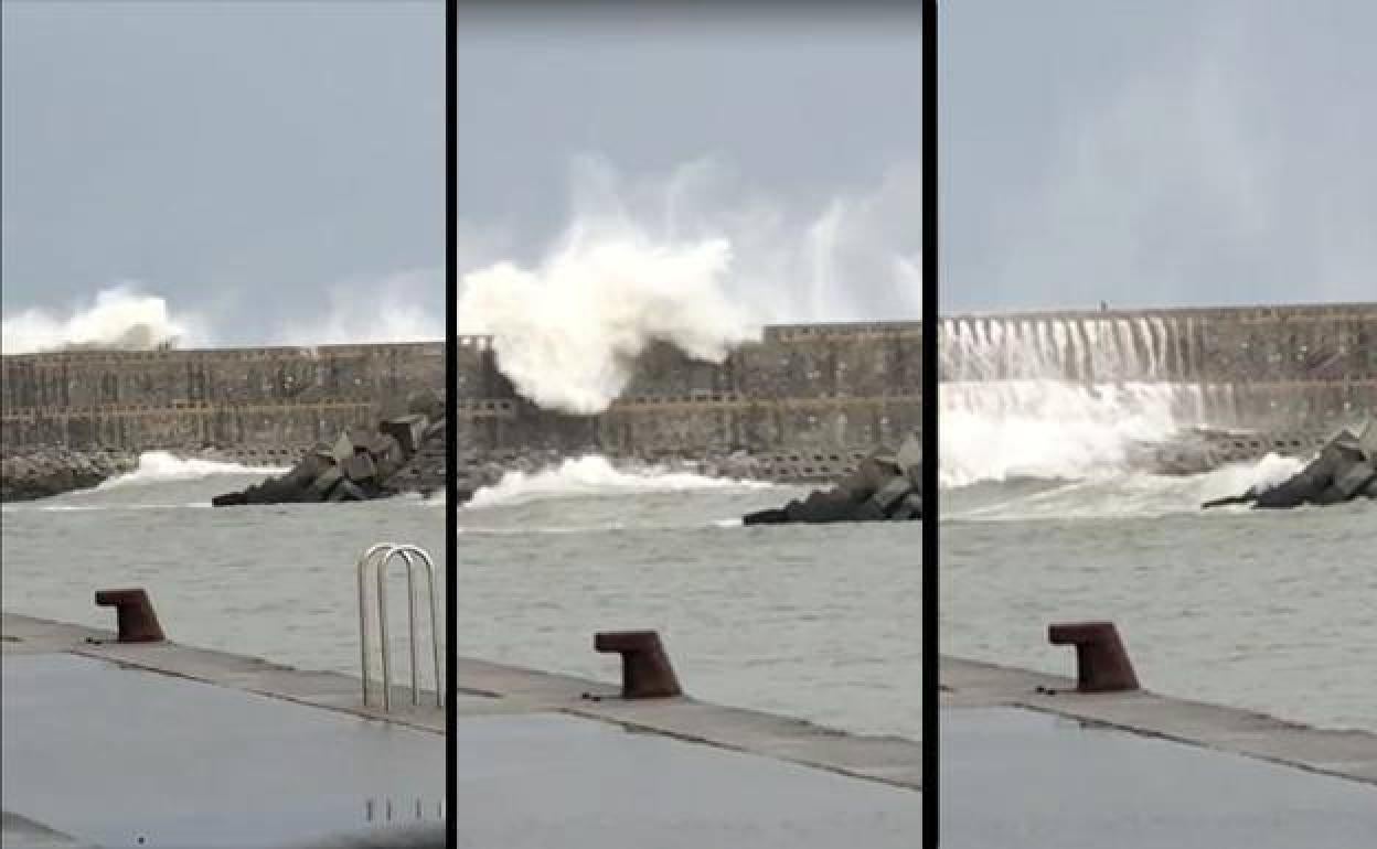 Una ola arrastra a un hombre que corría por el malecón de Orio, en Guipúzcoa