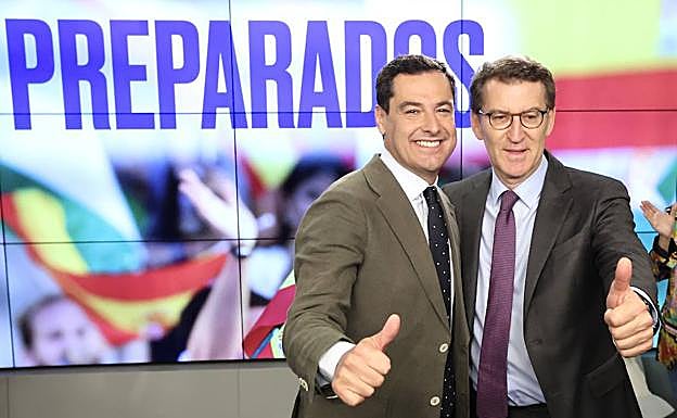 Juan Manuel Moreno Bonilla y Alberto Núñez Feijóo celebran en la sede nacional del PP el triunfo en Andalucía.