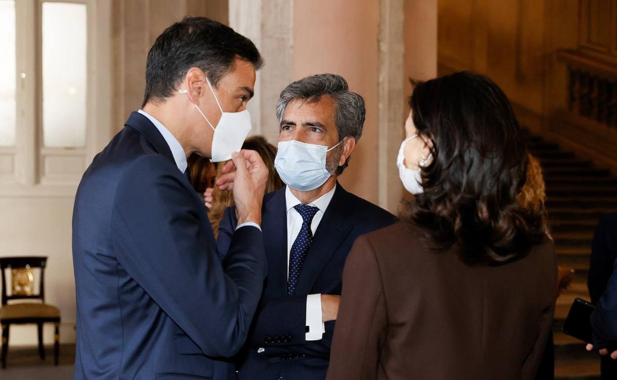 Pedro Sánchez, Carlos Lesmes y Pilar Llop.